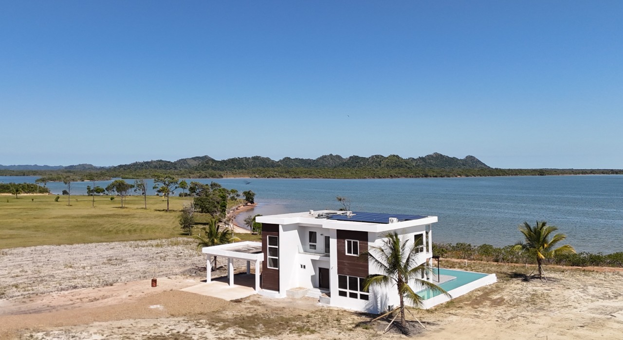 Home Sapodilla Island Aerial View of a Large Construction Site Surrounded by Water