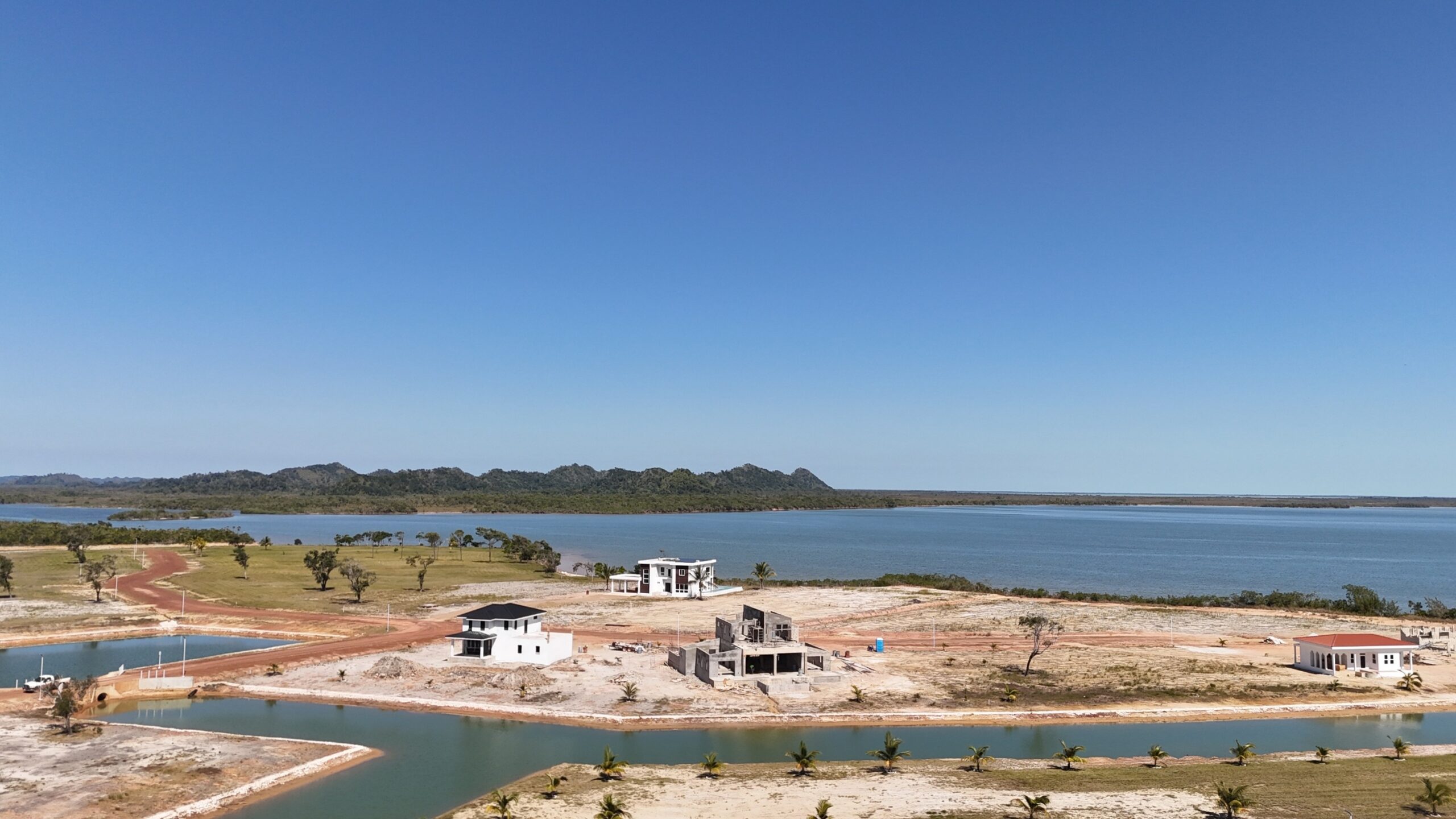 Incredible Setting Aerial View of Land Development with Waterway and Green Landscape
