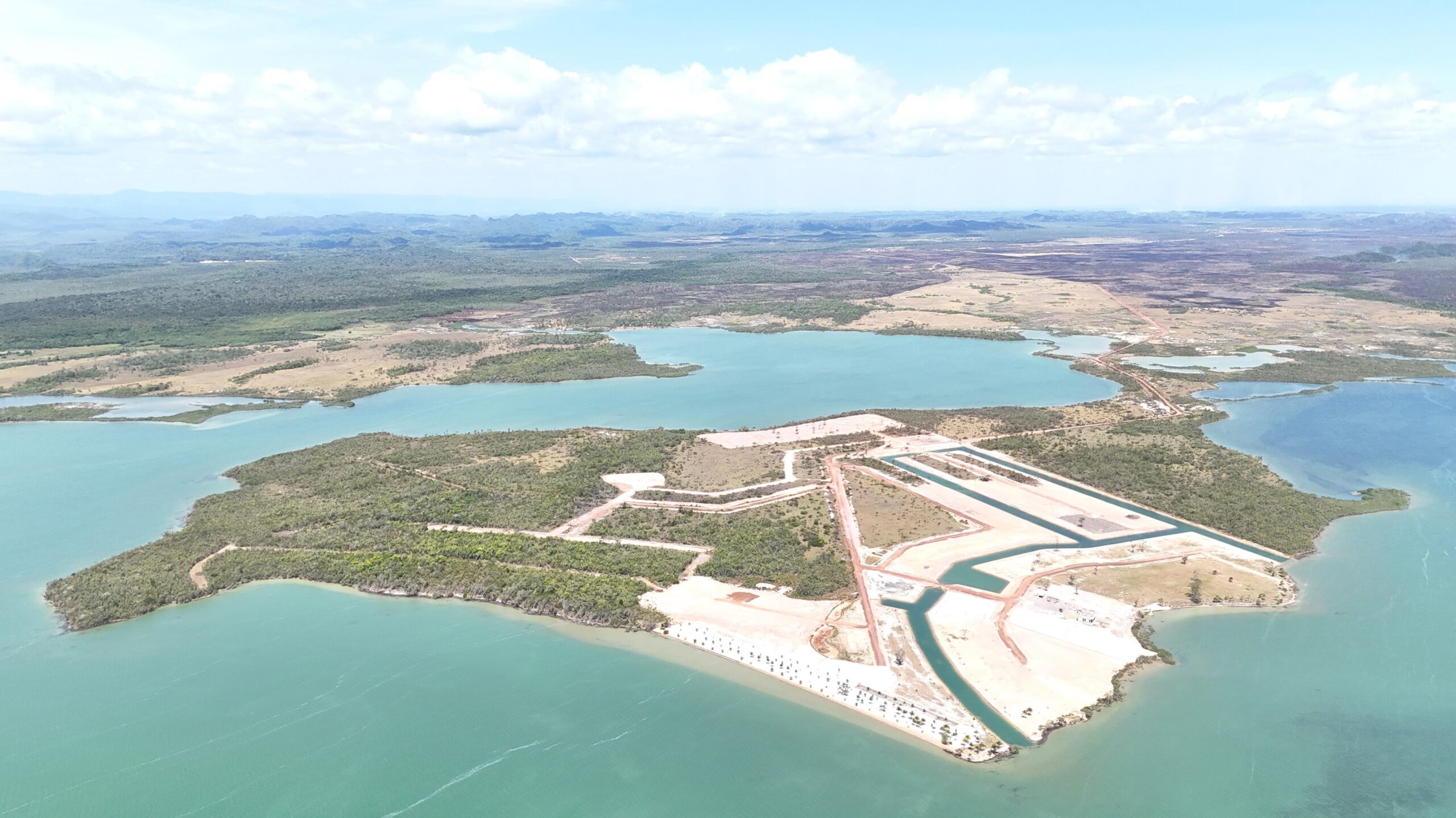Aerial View of a Large Construction Project Near Water