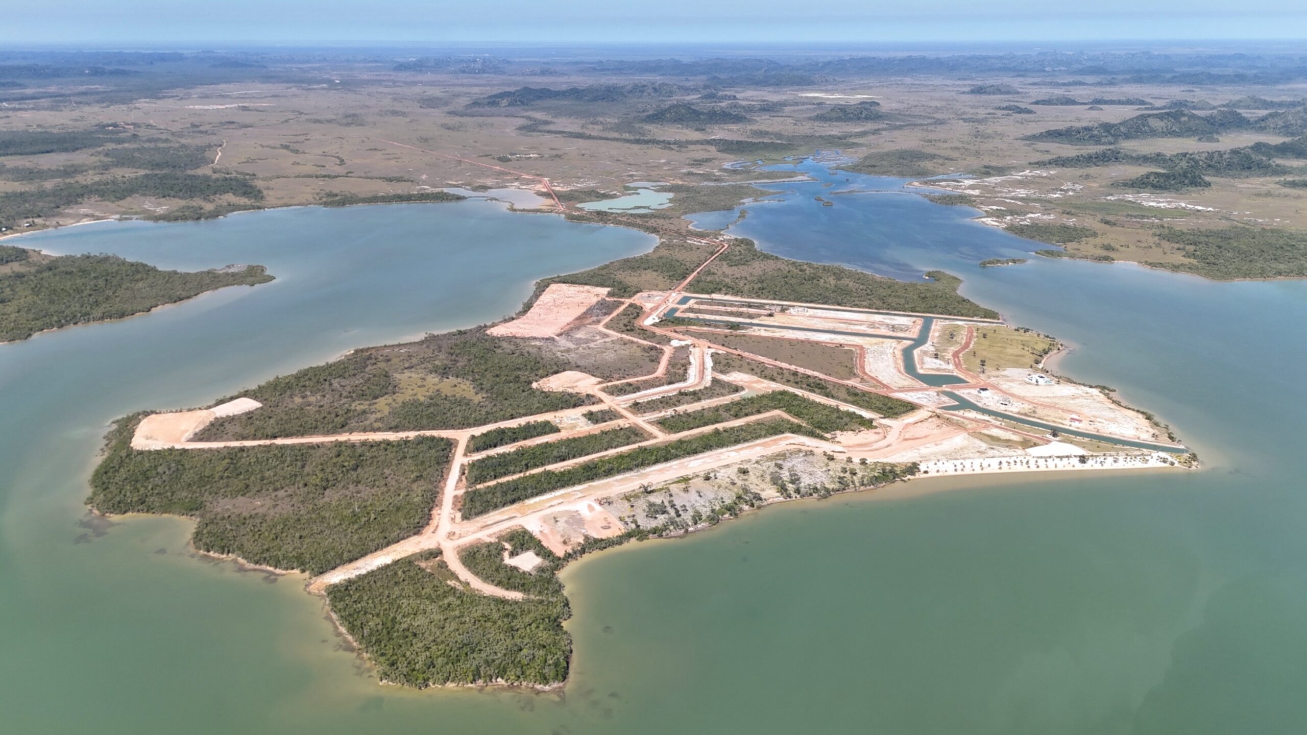 Phase 1 & 2 Aerial View of a Construction Site with Water and Land Development